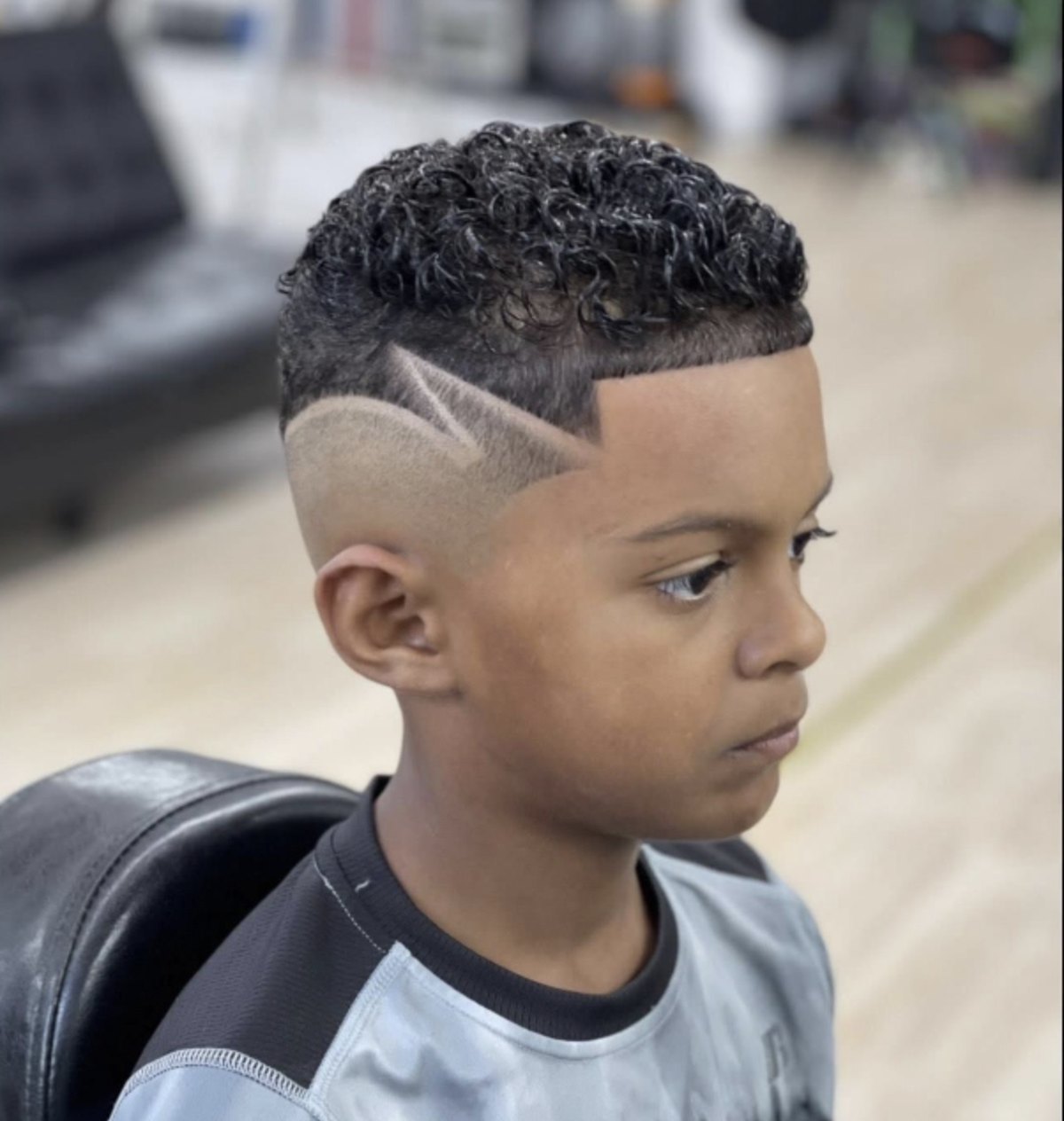 Custom razor design cut into a skin fade at VIC-TORY Barbershop West Chester PA