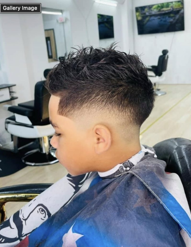 Mid fade with a textured top at VIC-TORY Barbershop West Chester PA